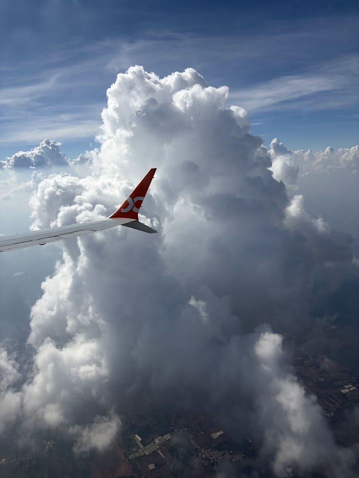 Airplane wing above clouds