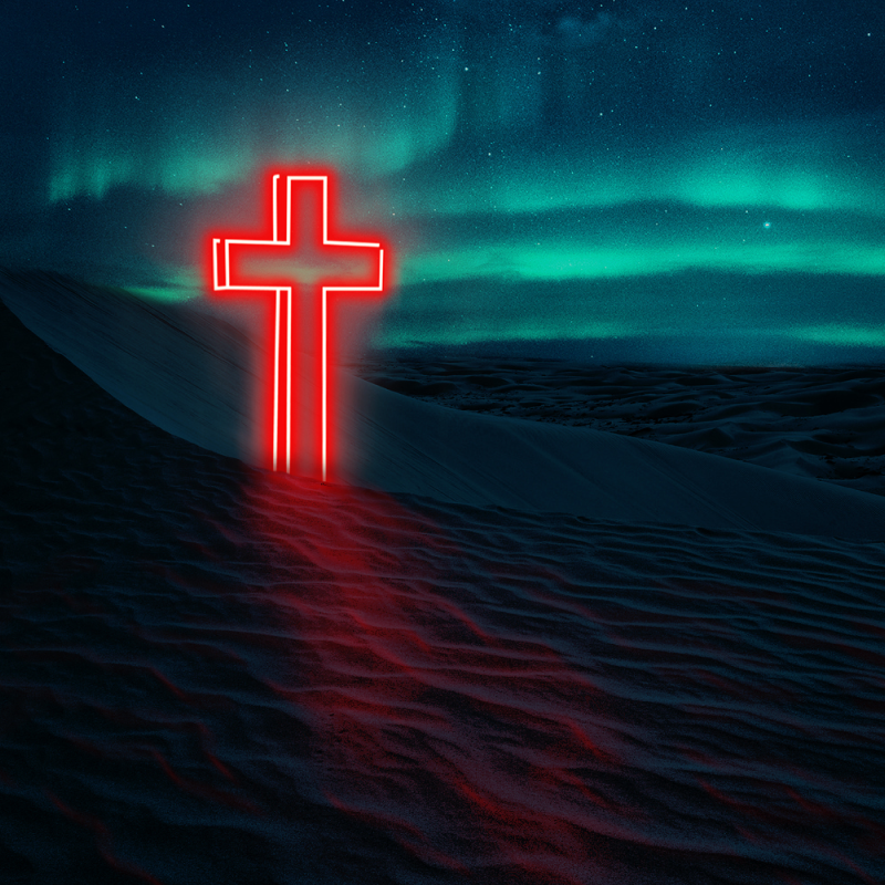 Neon cross on dunes under the aurora